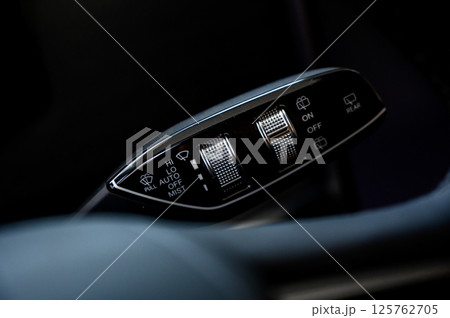 Close up view of car light switch control. Headlight switch, turn signal lever 125762705