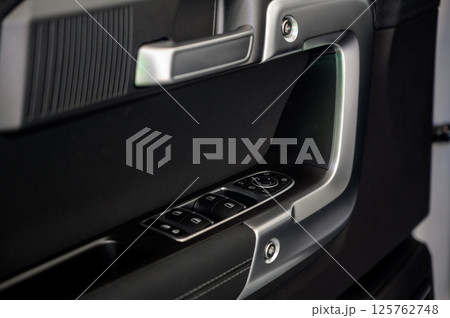 Car door with door handle and window control and adjustment button Car door with door handle and window control and adjustment button 125762748