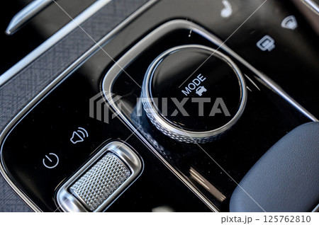 Automatic transmission selector in the interior of a modern car. 125762810