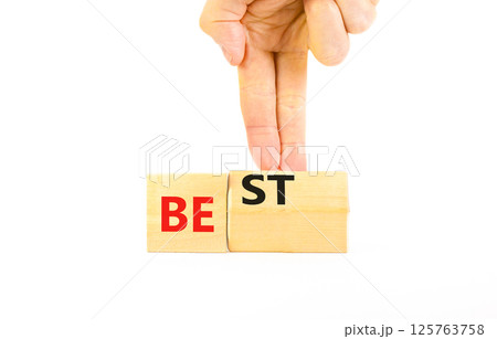 Motivational and inspirational be best symbol. Concept words Be best on beautiful wooden block. Beautiful white background Businessman hand. Business motivational be best concept. Copy space. 125763758