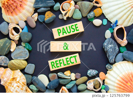 Pause and reflect symbol. Concept words Pause and reflect on beautiful block. Sea stones and shells. Beautiful black background. Business motivational lifestyle pause and reflect concept. Copy space. Pause and reflect symbol. Concept words Pause and reflect on beautiful block. Sea stones and shells. Beautiful black background. Business motivational lifestyle pause and reflect concept. Copy space. 125763799