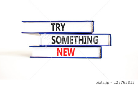 Try something new symbol. Concept words Try something new on beautiful books. Beautiful white paper background. Business motivational lifestyle try something new concept. Copy space. Try something new symbol. Concept words Try something new on beautiful books. Beautiful white paper background. Business motivational lifestyle try something new concept. Copy space. 125763813