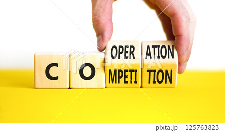 Competition or cooperation symbol. Concept word Competition or Cooperation on wooden cubes. Businessman hand. Beautiful white background. Business Competition or cooperation concept. Copy space. Competition or cooperation symbol. Concept word Competition or Cooperation on wooden cubes. Businessman hand. Beautiful white background. Business Competition or cooperation concept. Copy space. 125763823