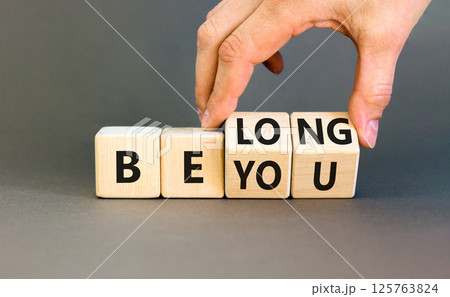 Belonging and belong symbol. Concept words Be you Belong on beautiful wooden block. Beautiful grey background Businessman hand. Business motivational belonging and belong concept. Copy space. Belonging and belong symbol. Concept words Be you Belong on beautiful wooden block. Beautiful grey background Businessman hand. Business motivational belonging and belong concept. Copy space. 125763824