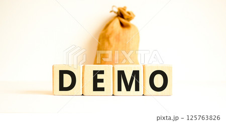 Demo symbol. Concept word Demo on beautiful wooden blocks. Beautiful canvas bag. Beautiful white table white background. Business and demo concept. Copy space. Demo symbol. Concept word Demo on beautiful wooden blocks. Beautiful canvas bag. Beautiful white table white background. Business and demo concept. Copy space. 125763826