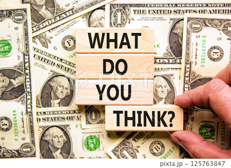 What do you think symbol. Concept words What do you think on beautiful wooden blocks. Dollar bills. Beautiful background from dollar bills. Business and What do you think concept. Copy space. 125763847