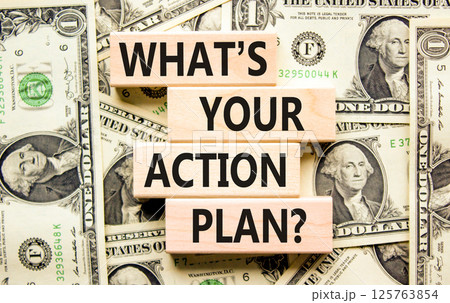 Action plan symbol. Concept words What is your action plan on beautiful wooden blocks. Dollar bills. Beautiful background from dollar bills. Business What is your action plan concept. Copy space 125763854