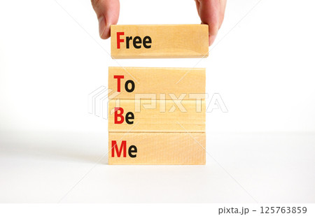 FTBM Free To Be Me symbol. Concept word FTBM Free To Be Me on beautiful wooden blocks. Beautiful white background. Business motivational FTBM Free To Be Me concept. Copy space. 125763859