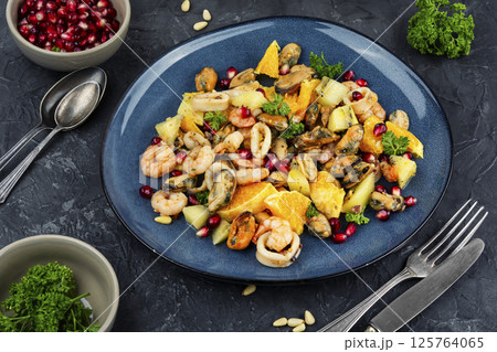 Seafood salad with orange. Seafood salad with orange. 125764065
