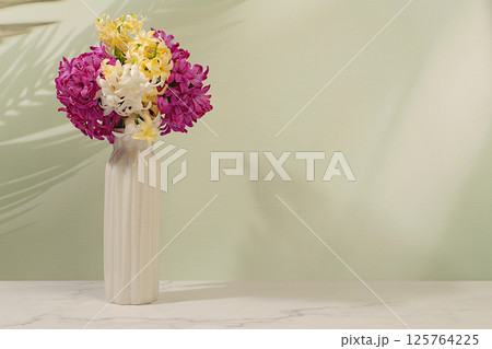 Beautiful banner of different varieties of hyacinths and muscari in a vase, template for design and screen. Abstract flower arrangement. Spring card, business card for product demonstration, Beautiful banner of different varieties of hyacinths and muscari in a vase, template for design and screen. Abstract flower arrangement. Spring card, business card for product demonstration, 125764225