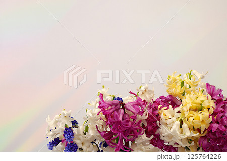 Abstract flower arrangement. Beautiful banner of different varieties of hyacinths and muscari, template for design and screen. Spring card, business card for product display, gift for loved ones. Abstract flower arrangement. Beautiful banner of different varieties of hyacinths and muscari, template for design and screen. Spring card, business card for product display, gift for loved ones. 125764226