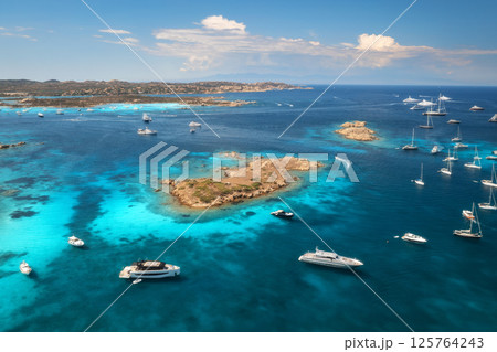 Aerial view of luxury yachts and boats in blue sea in summer 125764243
