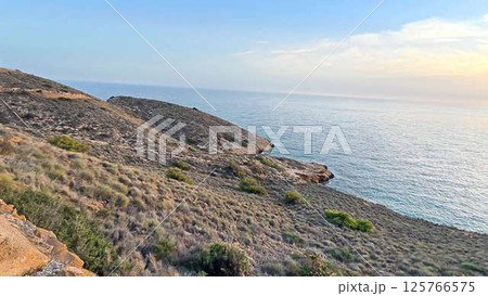 A breathtaking scenic coastal landscape that radiates beauty at the time of sunset 125766575