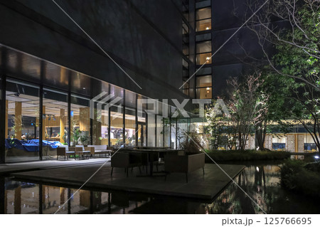 March 26 2025 Architecture With Illuminated Garden and Reflective Water at Night, Japan March 26 2025 Architecture With Illuminated Garden and Reflective Water at Night, Japan 125766695