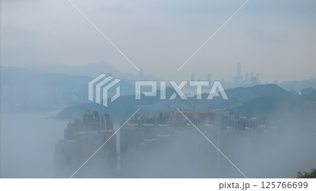 May 1 2021 Cityscape of Skyscrapers and Hills in Dense Morning Fog 125766699