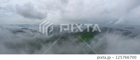 May 1 2021 Cityscape of Skyscrapers and Hills in Dense Morning Fog 125766700