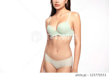 Confident beautiful young asian woman posing in light green lingerie on white background, Perfect body, Confident beautiful young asian woman posing in light green lingerie on white background, Perfect body, 125770551