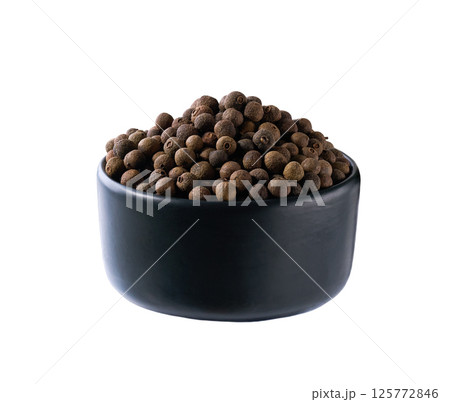 black ceramic bowl with allspice or Jamaican pepper isolated on white background. 125772846