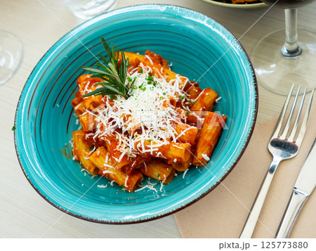 Rigatoni bolognese with fresh goat cheese Rigatoni bolognese with fresh goat cheese 125773880