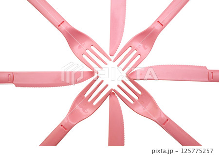 Pink plastic knife, forks for camping, isolated on white 125775257
