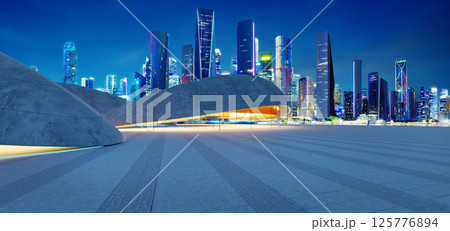 3d rendering Modern parking lot structure illuminating city skyline at dusk 125776894