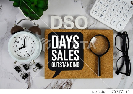 DSO - Days Sales Outstanding acronym with calculator, alarm clock and magnifying glass, Business concept background DSO - Days Sales Outstanding acronym with calculator, alarm clock and magnifying glass, Business concept background 125777154