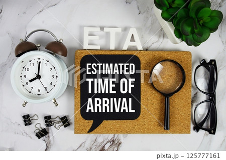 ETA - Estimated Time Of Arrival acronym with alarm clock and magnifying glass, business concept background ETA - Estimated Time Of Arrival acronym with alarm clock and magnifying glass, business concept background 125777161