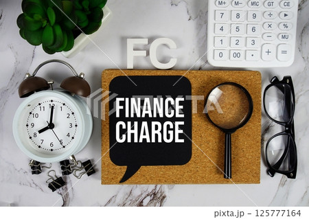 FC - Finance Charge acronym with calculator, alarm clock and magnifying glass, business concept background FC - Finance Charge acronym with calculator, alarm clock and magnifying glass, business concept background 125777164