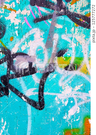 Abstract Graffiti Art on Turquoise Wall with Vintage 80s Vibe Abstract Graffiti Art on Turquoise Wall with Vintage 80s Vibe 125777272