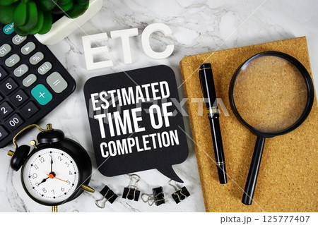 ETC - Estimated Time Of Completion acronym with calculator, alarm clock and magnifying glass, Business concept background 125777407