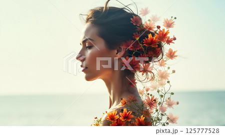 Woman adorned with flowers poses by the ocean during sunset, showcasing natural beauty and tranquility 125777528