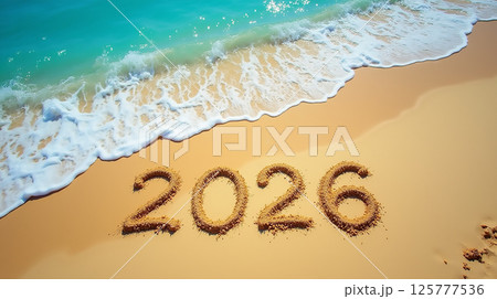 Year 2026 written in sand on a beach withのイラスト素材