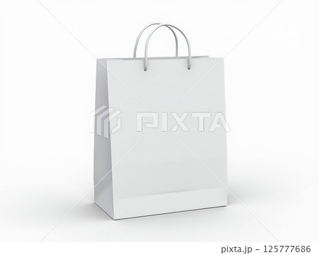 Empty white shopping bag on a clean surface with soft lighting in a minimalistic setting 125777686