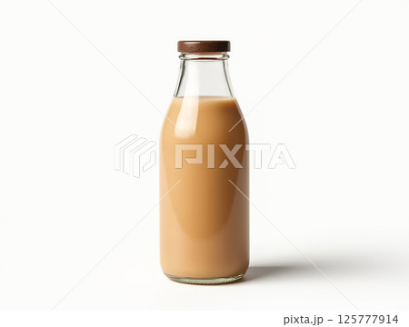 Creamy beverage in glass bottle with wooden cap placed on a light background 125777914