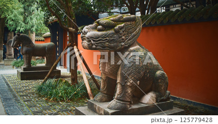 Chengdu, Sichuan, China. Stone Sculptures Of Kylins Or Qilin At Tomb Passage In Wuhou Memorial Temple. Kylins Is Mascot Dragon In China. Qilin Legendary Hooved Chimerical Creature That Appears In Chengdu, Sichuan, China. Stone Sculptures Of Kylins Or Qilin At Tomb Passage In Wuhou Memorial Temple. Kylins Is Mascot Dragon In China. Qilin Legendary Hooved Chimerical Creature That Appears In 125779428