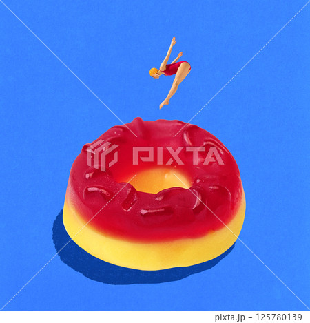 Young slim woman in red swimming suit and cap diving into giant gummy candy as pool against blue background. Contemporary art collage Young slim woman in red swimming suit and cap diving into giant gummy candy as pool against blue background. Contemporary art collage 125780139