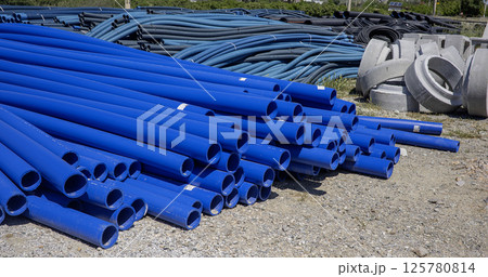 Blue PVC pipes, plastic pipes for water supply 125780814