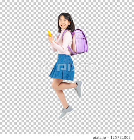 Elementary school girl jumping while using a smartphone. Full-body photo PNG with transparent background precisely cut out by hand. Elementary school girl jumping while using a smartphone. Full-body photo PNG with transparent background precisely cut out by hand. 125781002