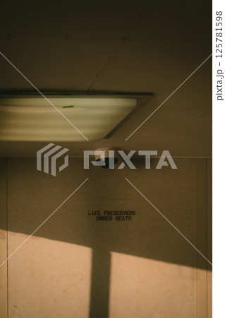 A security camera is strategically mounted on the ceiling of the building 125781598