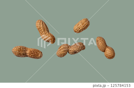 Peanuts isolated on color background Peanuts isolated on color background 125784153