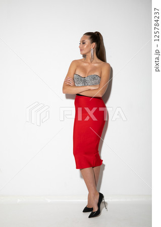 Woman In Evening Cocktail Dress At Celebration 125784237