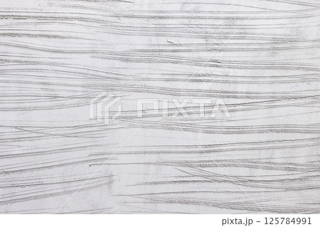 Concrete plastering wall and scrate surface to prepare for tile installation. 125784991