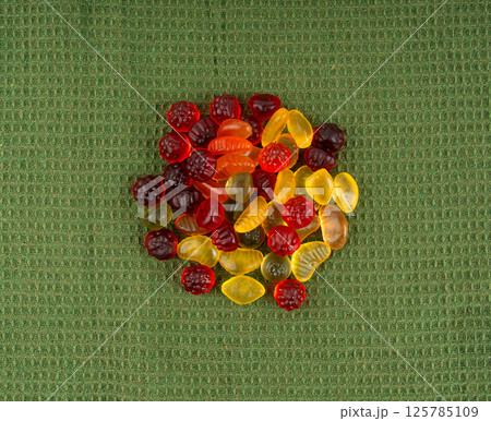 Fruit gummy candy pile, vegan chewing marmalade pills, jelly gumdrops heap Fruit gummy candy pile, vegan chewing marmalade pills, jelly gumdrops heap 125785109