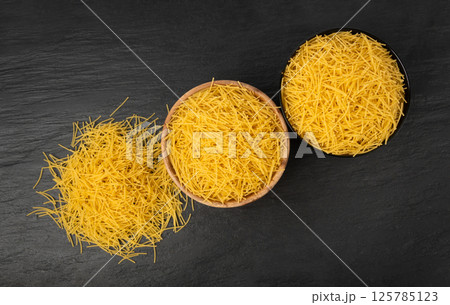 Raw vermicelli, gold soup pasta, small scattered homemade noodles, thin macaroni 125785123