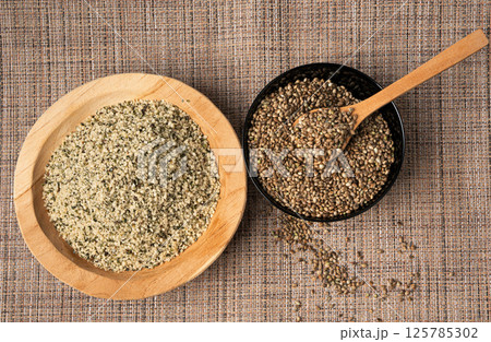 Shelled hemp seeds pile, peeled cannabis grains, marijuana kernels without peel Shelled hemp seeds pile, peeled cannabis grains, marijuana kernels without peel 125785302