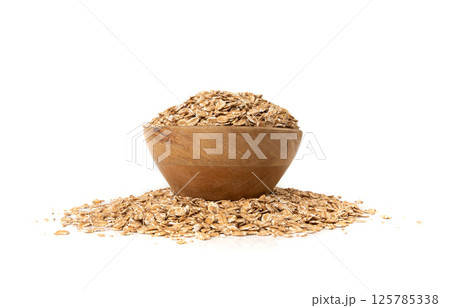 Spelt flakes isolated, dry raw rolled flat oat grains, wheat, oatmeal or bran, barley rye cereals 125785338