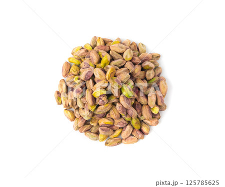 Fried salt pistachio nuts isolated. Baked pistachios pile, roasted green pistache fruits on white 125785625