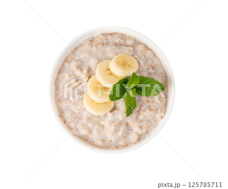 Cooked spelt in bowl isolated. Oatmeal milk porridge with fruits and berries Cooked spelt in bowl isolated. Oatmeal milk porridge with fruits and berries 125785711