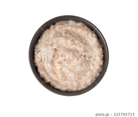Cooked spelt in bowl. Oatmeal milk porridge, boiled emmer or spelt, healthy cereal food Cooked spelt in bowl. Oatmeal milk porridge, boiled emmer or spelt, healthy cereal food 125785713