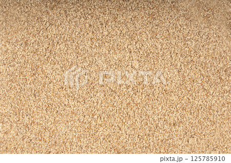 Milk thistle seeds powder, crushed silybum marianum grains pile, milled dry blessed milkthistle 125785910